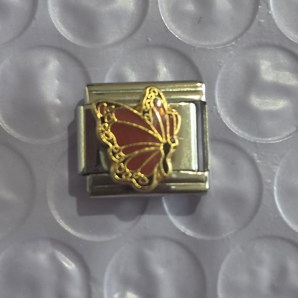 January birthstone butterfly Italian charm with gold outline and red enamel